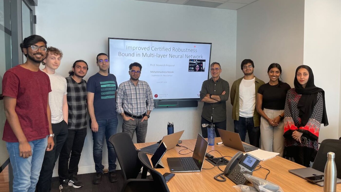 Rushendra with the Trustworthy AI Lab group after a research summary presentation.